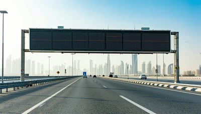 Modern highway in Dubai with digital road toll signage